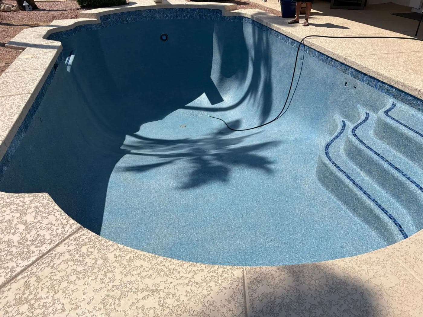 A pool shell prepared for repair and new finish